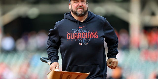 A member of Cleveland's ground crew removed a bird