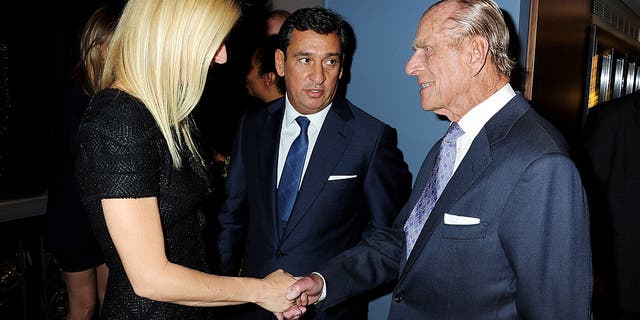 gwyneth paltrow shaking hands with prince philip