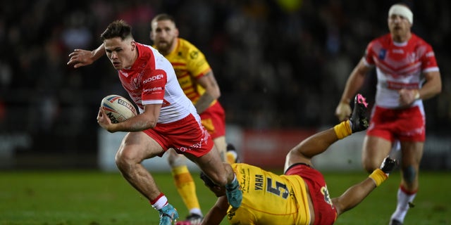 St Helens player breaks a tackle