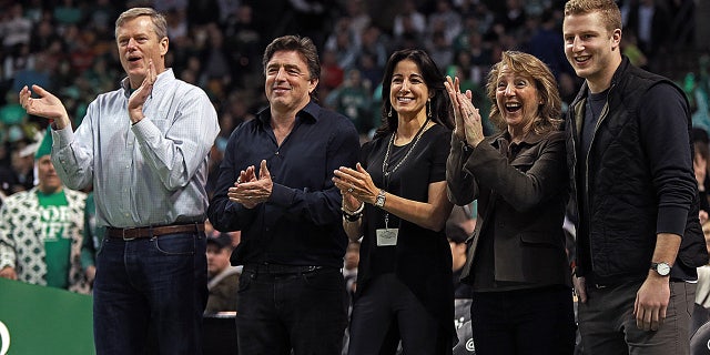 Charlie Baker, son and wife at Celtics basketball game