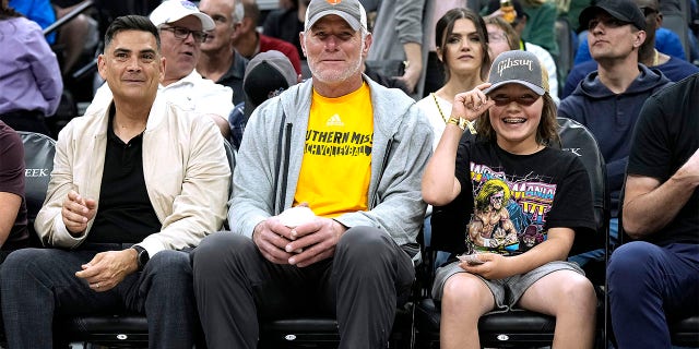 Brett Favre attends an NBA basketball game