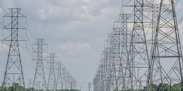 HOUSTON, TEXAS - JUNE 09: Transmission towers are seen at the CenterPoint Energy powerplant on June 09, 2022 in Houston, Texas. Power demand in Texas is expected to set new all-time highs as heatwaves surge to levels rarely seen outside of summer, and economic growth contributes to higher usage in homes and businesses. The Electric Reliability Council of Texas (ERCOT) has said that it has enough resources to meet demand. (Photo by Brandon Bell/Getty Images)