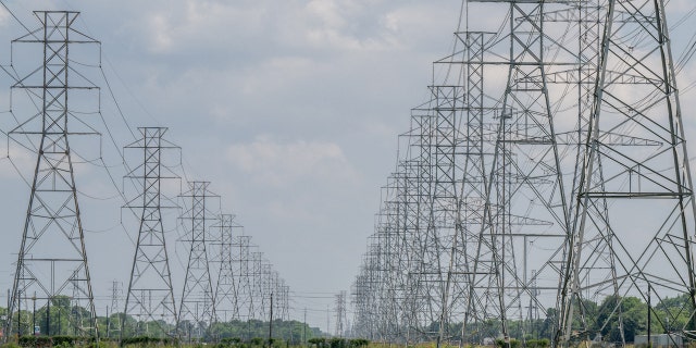 HOUSTON, TEXAS - JUNE 09: Transmission towers are seen at the CenterPoint Energy powerplant on June 09, 2022 in Houston, Texas. Power demand in Texas is expected to set new all-time highs as heatwaves surge to levels rarely seen outside of summer, and economic growth contributes to higher usage in homes and businesses. The Electric Reliability Council of Texas (ERCOT) has said that it has enough resources to meet demand. (Photo by Brandon Bell/Getty Images)