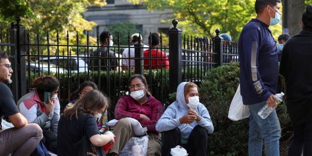 Migrants sitting outside VP's house