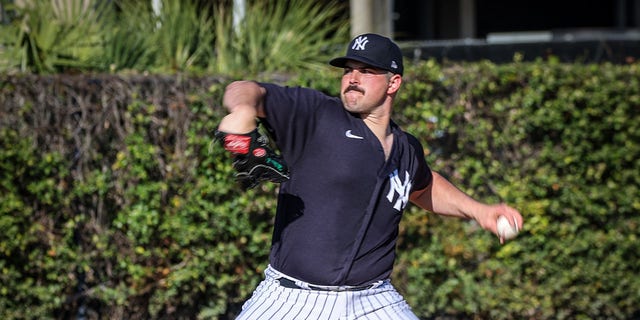 Yankees pitcher Carlos Rodon throws during spring training