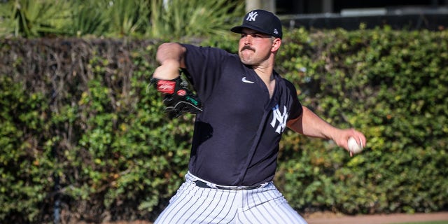 Yankees pitcher Carlos Rodon throws during spring training