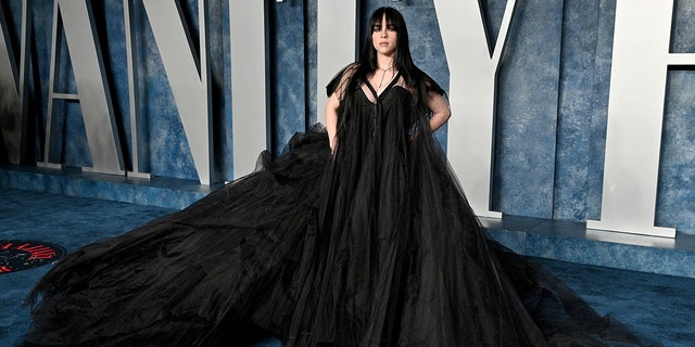 Billie Eilish in a flaring black gown on the Vanity Fair red carpet for the Oscars after party