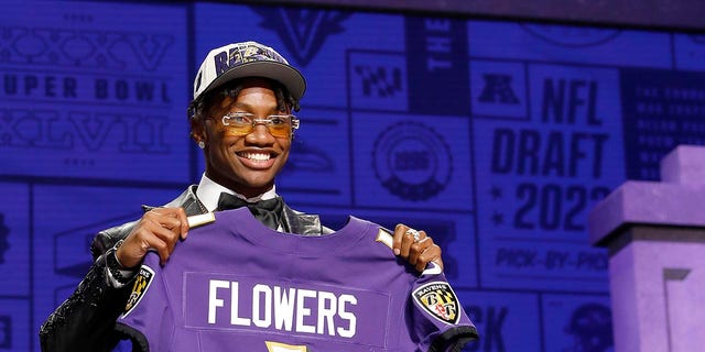 Zay Flowers poses after being drafted by the Ravens