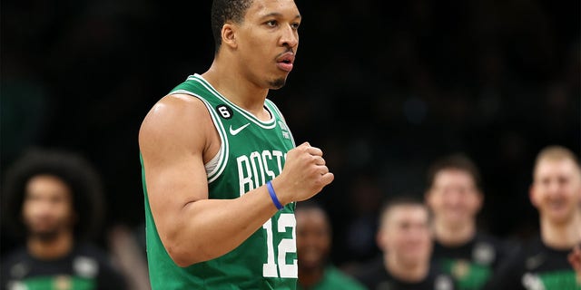 Grant Williams pumps his fist against the Sixers