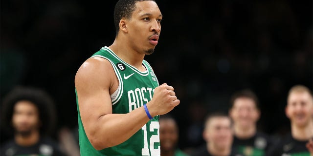 Grant Williams raises his fist against the Sixers