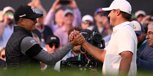 Claude Harmon III congratulates Brooks Koepka on winning the 2023 PGA Championship