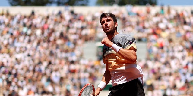 Cameron Norrie celebrates a point during the first round of the French Open