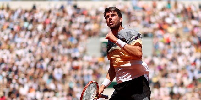 Cameron Norrie celebrates a point during the first round of the French Open