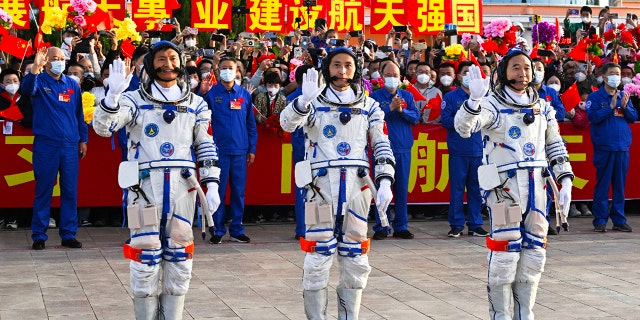 Chinese astronauts attend the ceremony