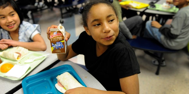 Student with chocolate milk