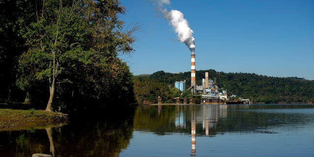 NEW EAGLE, PA - SEPTEMBER 24: A plume of exhaust extends from the Mitchell Power Station, a coal-fired power plant built along the Monongahela River, 20 miles southwest of Pittsburgh, on September 24, 2013 in New Eagle, Pennsylvania. The plant, owned by FirstEnergy, will be one of two plants in the region to be shut down, affecting 380 employees. The Evironmental Protection Agency (EPA) and the Obama administration have been taking major steps to get coal-fired power plants into compliance with clean air regulations. (Photo by Jeff Swensen/Getty Images)