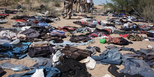 Minutemen pass through a stretch of remote Sonoran desert that has been damaged by groups of migrants having to discard clothing and medicine on their journey north. Thirty miles from the mexican border, Minutemen volunteers from across America spend time patrolling a large private ranch in the Altar Valley of southern Arizona, searching for "illegal" migrants making their way north through the harsh desert terrain. Although most of the Minutemen carry guns, they are under strict instructions to not chase or apprehend migrants, but instead to report sightings to the border patrol.