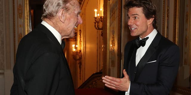 tom cruise beaming at prince philip