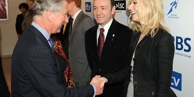 prince charles shaking hands with gwyneth paltrow