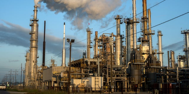 BATON ROUGE, LOUISIANA - OCTOBER 12: Smoke billows from one of many chemical plants in the area October 12, 2013. 'Cancer Alley' is one of the most polluted areas of the United States and lies along the once pristine Mississippi River that stretches some 80 miles from New Orleans to Baton Rouge, where a dense concentration of oil refineries, petrochemical plants, and other chemical industries reside alongside suburban homes. (Photo by Giles Clarke/Getty Images.)