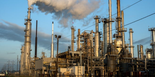 BATON ROUGE, LOUISIANA - OCTOBER 12: Smoke billows from one of many chemical plants in the area October 12, 2013. 'Cancer Alley' is one of the most polluted areas of the United States and lies along the once pristine Mississippi River that stretches some 80 miles from New Orleans to Baton Rouge, where a dense concentration of oil refineries, petrochemical plants, and other chemical industries reside alongside suburban homes. (Photo by Giles Clarke/Getty Images.)