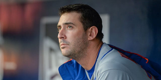 Matt Harvey sits on the bench for the Mets