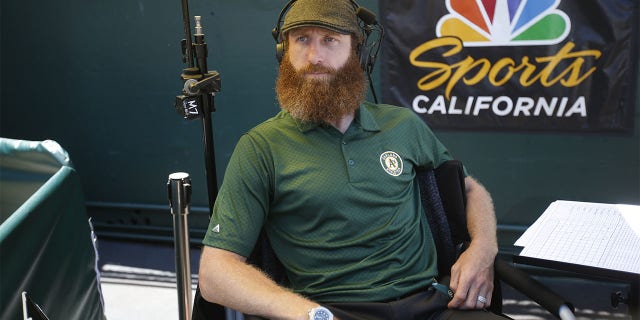 Dallas Braden sits behind the plate