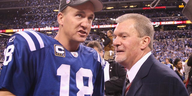 Peyton Manning stands with Colts owner Jim Irsay after winning the AFC Championship in 2010