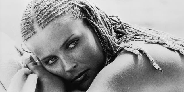 A close-up of a black and white photo of Bo Derek in the movie 10