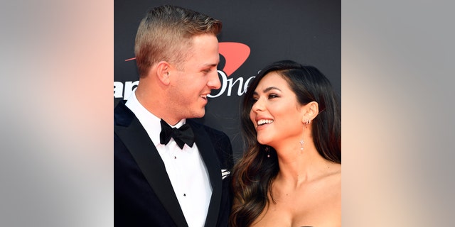 A close-up of Jared Goff and Christen Harper looking at each other on the red carpet