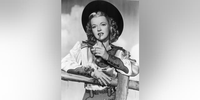 A close-up of Dale Evans dressed up as a cowgirl