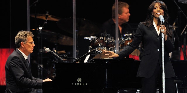 David Foster playing piano while Donna Summer sings