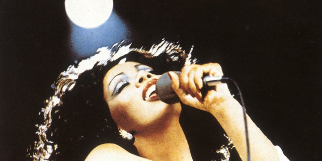 A closeup of Donna Summer on stage