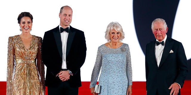 Kate Middleton in a shimmering gold dress, Prince William in a tuxedo, Queen Camilla in a light blue gown and King Charles in a tuxedo