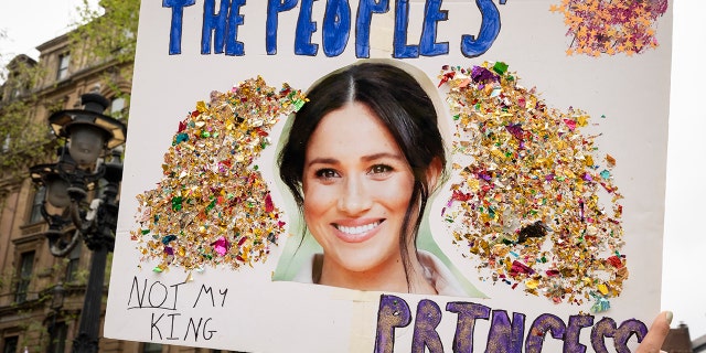 A close-up sign with Meghan Markles face