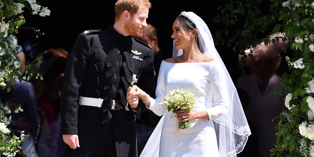 Meghan Markle and Prince Harry looking at each other on their wedding day