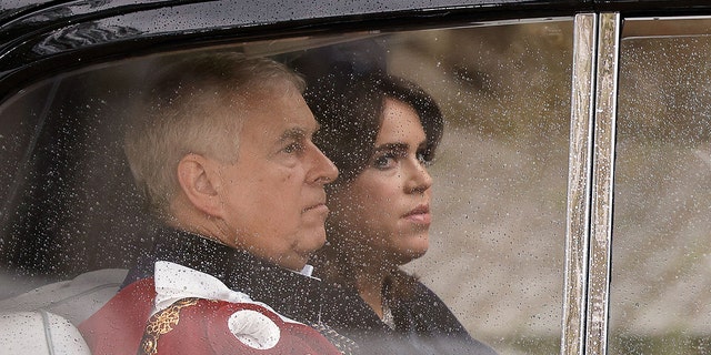 Prince Andrew sitting in a car with his daughter Princess Eugenie