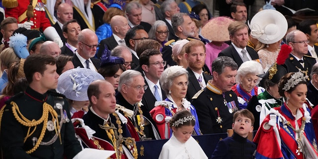 The british royal family sitting together at Westminster Abbey