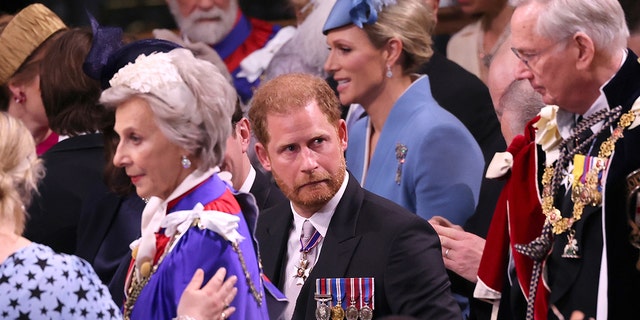 Prince Harry in his morning suit making a funny face