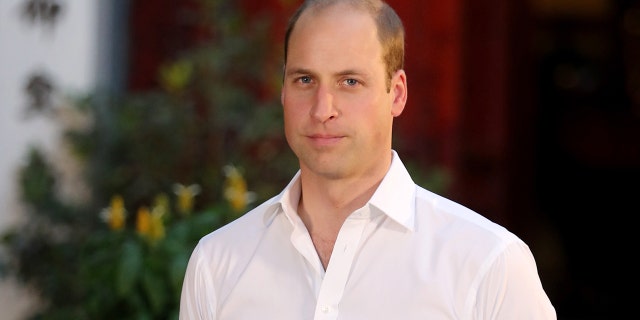 A close-up of Prince William in a white shirt