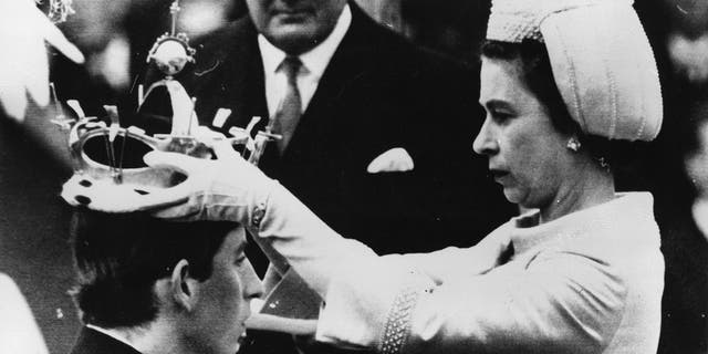 Prince Charles being crowned with coronet by his mother Queen Elizabeth