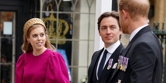 Prince Harry chatting with Princess Beatrice in a bright pink dress