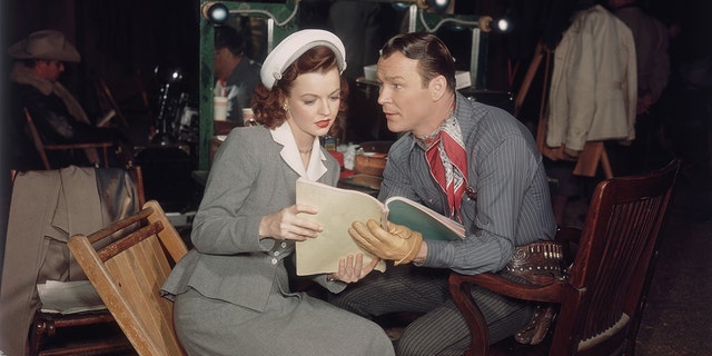 Roy Rogers reading to Dale Evans