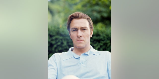 Christopher Plummer wearing a light blue shirt