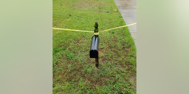 Mailbox with crime scene tape in Harnett County