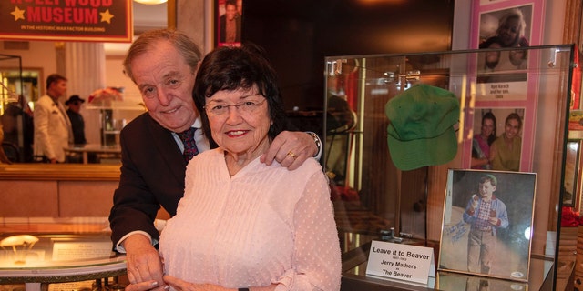 Jerry Mathers embracing his mother Marilyn Mathers at The Hollywood Museum