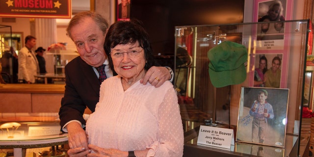 Jerry Mathers embracing his mother Marilyn Mathers at The Hollywood Museum