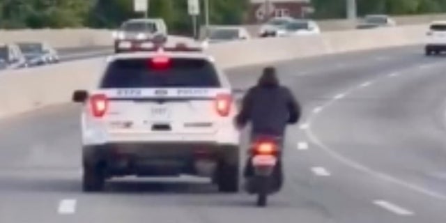 New York Police Division cruiser seen in video swerving dangerously near moped