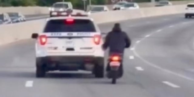 New York Police Department cruiser seen in video swerving dangerously close to moped 2 NYPD moped
