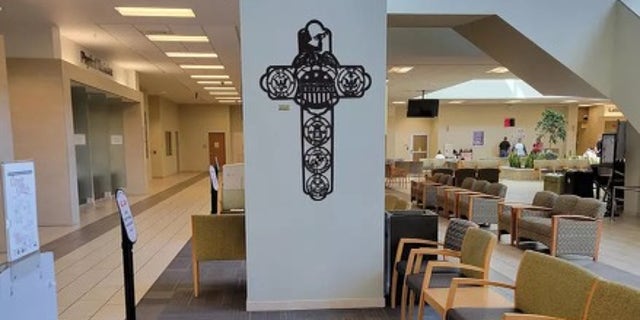 cross-shaped sign in veterans facility lobby